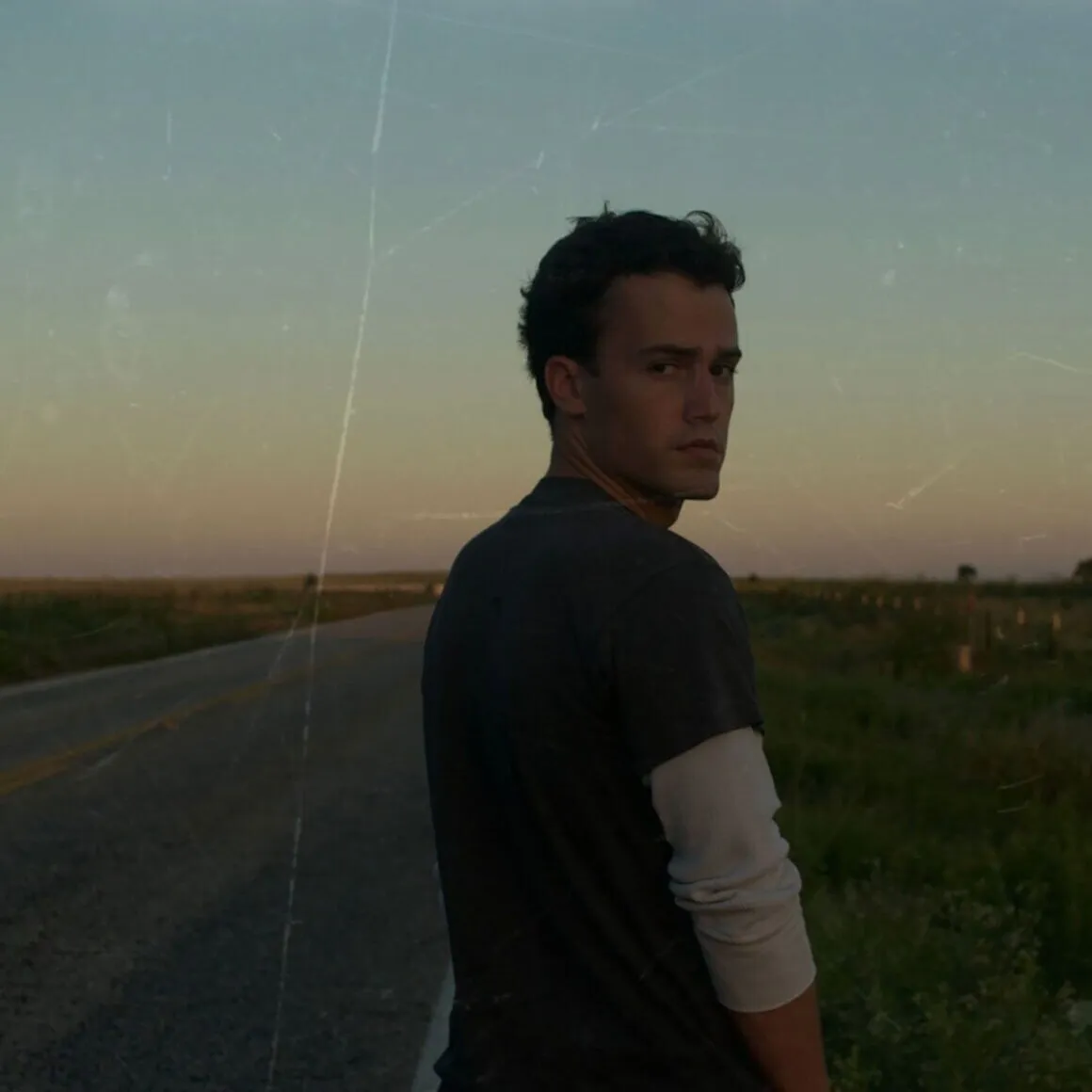 Braedon Barnhill walking the road at golden hour — Long Way to Lubbock